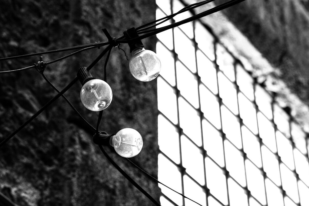 Studio lamps hanging from a lighting grid