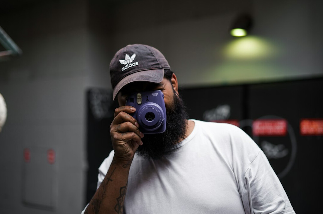 Man camera trainer portrait with beard